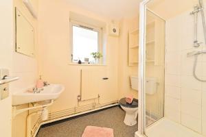 a bathroom with a toilet and a sink and a shower at For Students Only Pirvate Ensuites and Non-Ensuite Rooms with Shared Bathroom at St Andrews Gardens in Liverpool in Liverpool