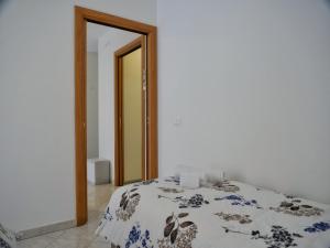 Posteľ alebo postele v izbe v ubytovaní ROSE DE MAR - Grazioso appartamento con posto auto