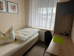 Postel nebo postele na pokoji v ubytování Gasthof „Zum Schwan“