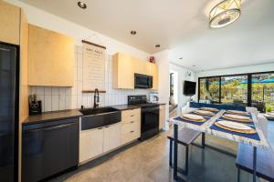 a kitchen with a table and a counter top at Tequila Long Time #311 in Chelan