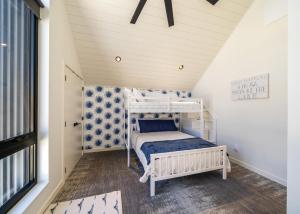 a small bedroom with a bunk bed in a attic at Tequila Long Time #311 in Chelan +27 photos