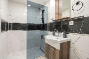 a bathroom with a sink and a shower at Central Istanbul Apartments in Istanbul