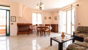 a living room with a couch and a table at Appartamento l'Ulivo in Cala Gonone