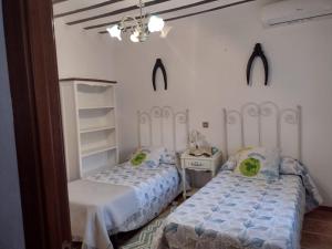 Posteľ alebo postele v izbe v ubytovaní Casa Rural El Rincón del Valle