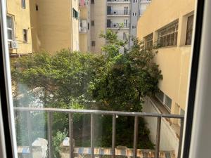 a view from a window of a building with trees at Delfini dei Due Mari in Taranto