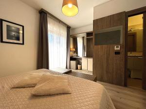 Łóżko lub łóżka w pokoju w obiekcie Hotel Regina