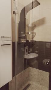 a bathroom with a sink and a glass shower at Home, far away from Home 2 in Budapest +43 photos