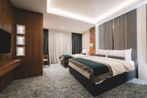 Voodi või voodid majutusasutuse Bristol Hotel Podgorica toas