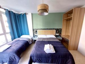 A bed or beds in a room at Habitaciones Barra89
