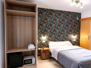 A bed or beds in a room at Habitaciones Barra89