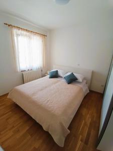 Postel nebo postele na pokoji v ubytování Apartment Katarina