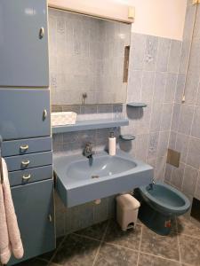 a bathroom with a sink and a toilet at Apartment Katarina in Split