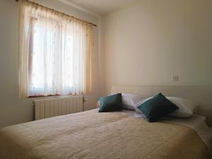 Postel nebo postele na pokoji v ubytování Apartment Katarina