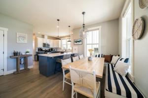 a kitchen and dining room with a wooden table and chairs at On Lake Time #86 in Chelan