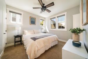a bedroom with a bed and a ceiling fan at On Lake Time #86 in Chelan +35 photos