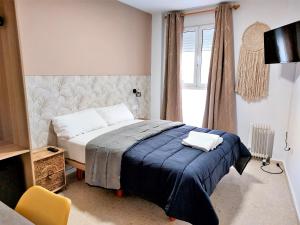A bed or beds in a room at Habitaciones Barra89