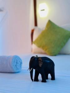 Letto o letti in una camera di Mango Tree House