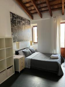 a bedroom with a bed and a dresser at Valencia Central Loft in Valencia