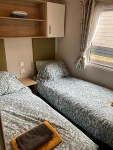 A bed or beds in a room at 173A Woodland Way