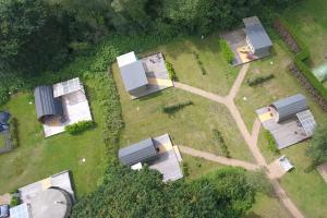 an overhead view of a group of huts in a field at Glamping at Back Of Beyond Touring Park in Saint Leonards