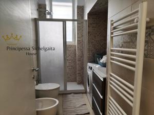 a bathroom with a toilet and a sink and a shower at Principessa Sichelgaita House in Salerno