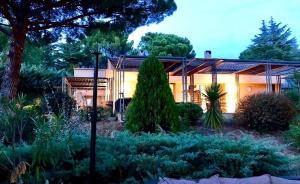 a house with a garden in front of it at Provence mon amour in La Tour-dʼAigues