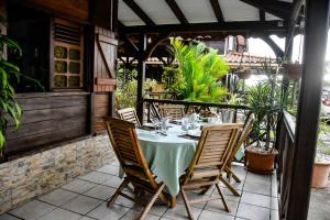a table and chairs sitting on a patio at Chalet WEITHY in Bois dʼInde