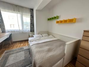 Una cama o camas en una habitación de Bel Dom - The Cosy, 2 bedrooms family apartment