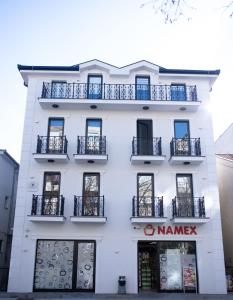 a white building with a nameng sign on it at Solaris in Mostar