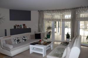 a living room with a couch and a table at Holiday Home Uma in Visoko