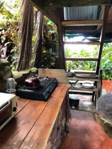 a wooden table with a telephone on top of it at Ocean View rustic cabin in the jungle by the surf in Pavones