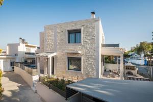 a large brick house with a roof at Villa Antoni in Galatás