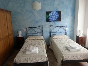 Postel nebo postele na pokoji v ubytování B&B Il Feriolo