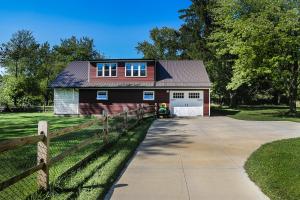 a red barn with a fence next to a driveway at Modern Industrial Farmhouse - The Wayback in Orange