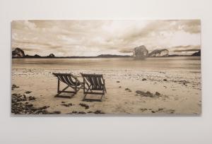 two chairs sitting in the sand on a beach at Ibirriaga - baskeyrentals in Mutriku