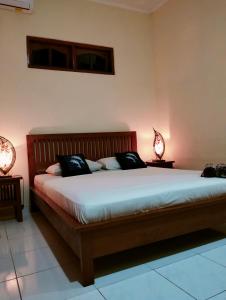 Postel nebo postele na pokoji v ubytování Kaia Lovina Guest House