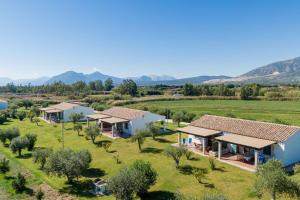 an aerial view of a row of houses in a field at Su Cannonariu in Orosei