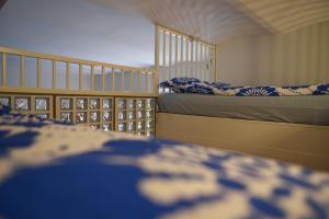 a bedroom with two bunk beds with blue and white pillows at Apartment Diana Park in Helsinki