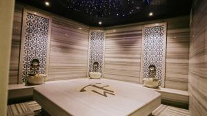 a japanese spa room with a massage table at Faustina Hotel & Spa in Güzelçamlı +35 photos