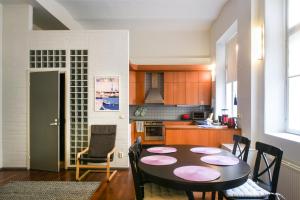 a kitchen with a table and chairs in a room at Apartment Diana Park in Helsinki