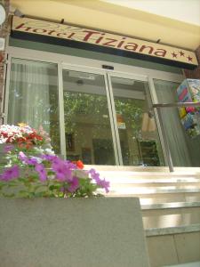 a store front with flowers in front of it at Hotel Tiziana in Rimini