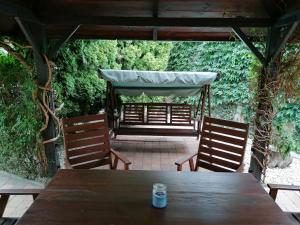 a wooden table with two chairs at Ubytování Na Špacíru in Mikulov