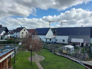 a group of houses with solar panels on their roofs at Sonnige Ferienwohnung bei Familie Köhler in Kappel-Grafenhausen