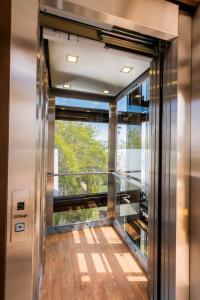 an elevator in a building with a large window at Dreams Hotel Boutique in Arequipa