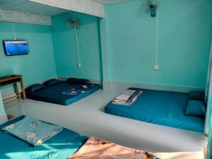 Ліжко або ліжка в номері Nhà nghỉ Ngọc Phượng Hòn Sơn