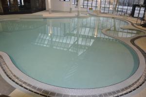 a large swimming pool in a building at Résidences Durbuy in Durbuy