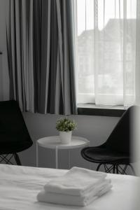 Uma cama ou camas num quarto em Hotel de la Bourse