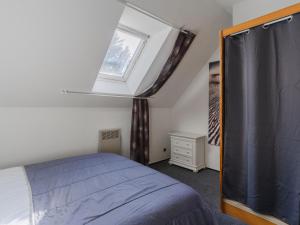 a bedroom with a bed and a skylight at Holiday Home Le Clos du Golf-2 by Interhome in Cabourg