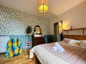 Łóżko lub łóżka w pokoju w obiekcie Le jardin secret - Jardin/Loire