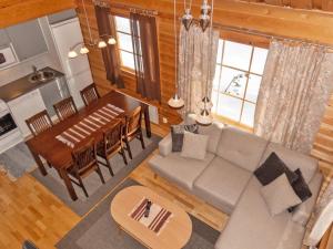 an overhead view of a living room and dining room at Holiday Home Mervinrinne by Interhome in Luosto